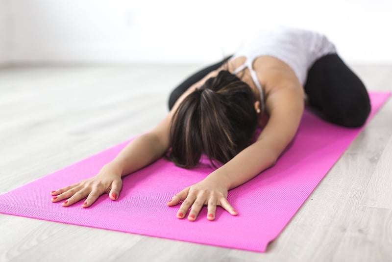 Yoga pose by the beach